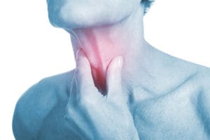 senior man with throat or neck irritation